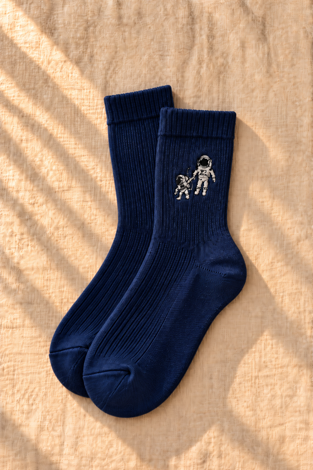 Small Steps Co. big kids navy bamboo crew socks with embroidered astronauts