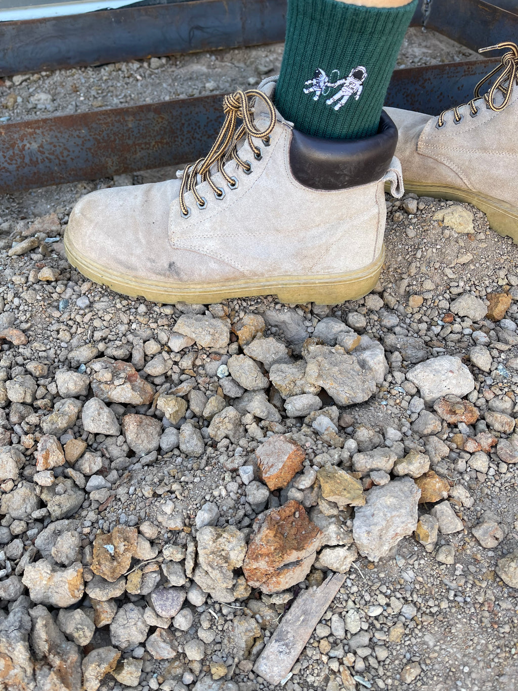Small Steps Co. deep green bamboo sock with astronaut embroidery worn with work boots