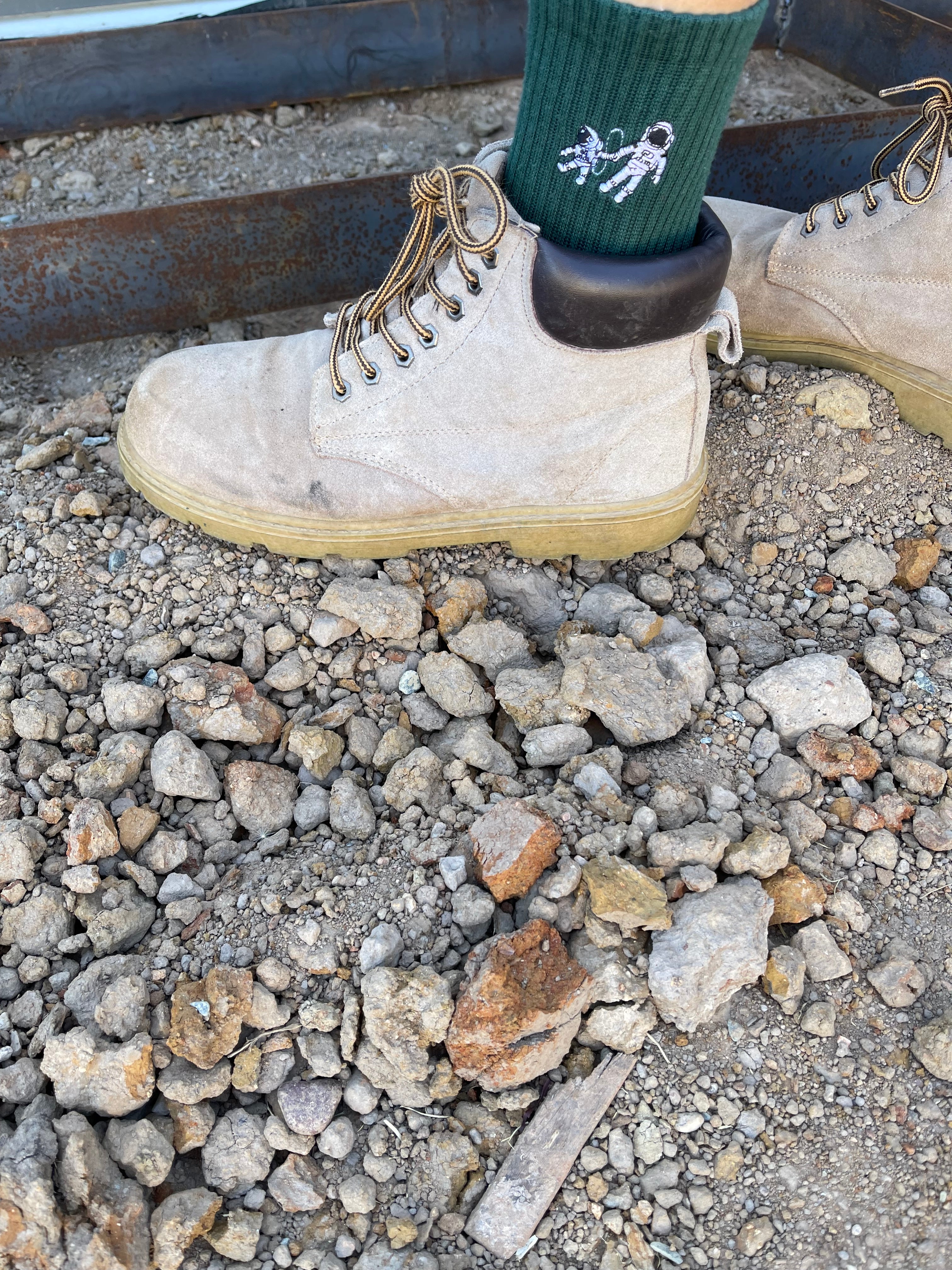 Small Steps Co. deep green bamboo sock with astronaut embroidery worn with work boots