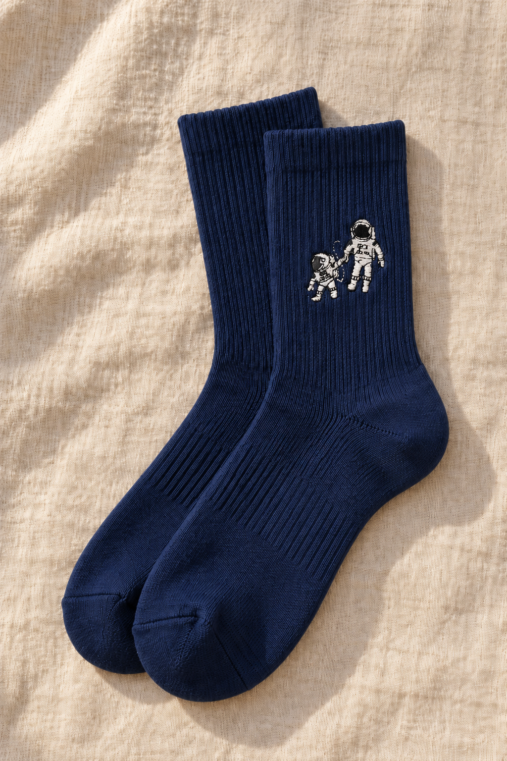 Small Steps Co. men's navy bamboo crew socks with embroidered astronaut emblem