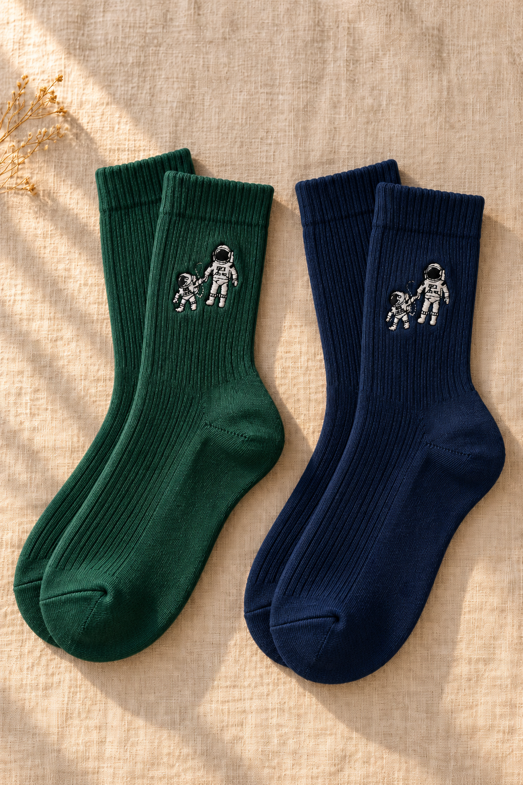Small Steps Co. women's bamboo crew socks with embroidered astronaut emblem, on linen
