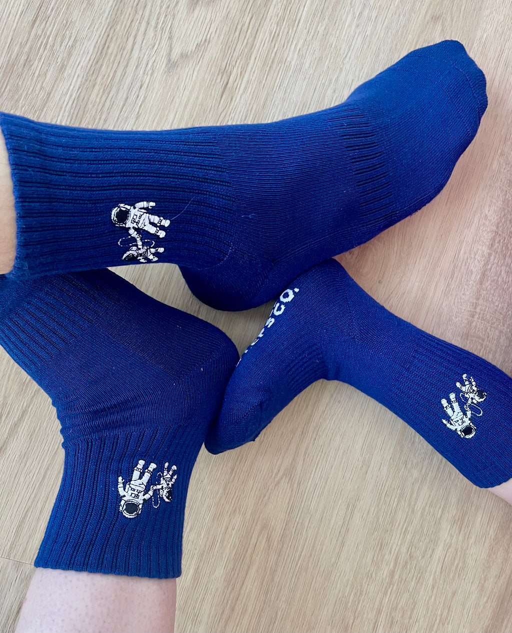 Navy Small Steps Co. bamboo socks worn by adult and child